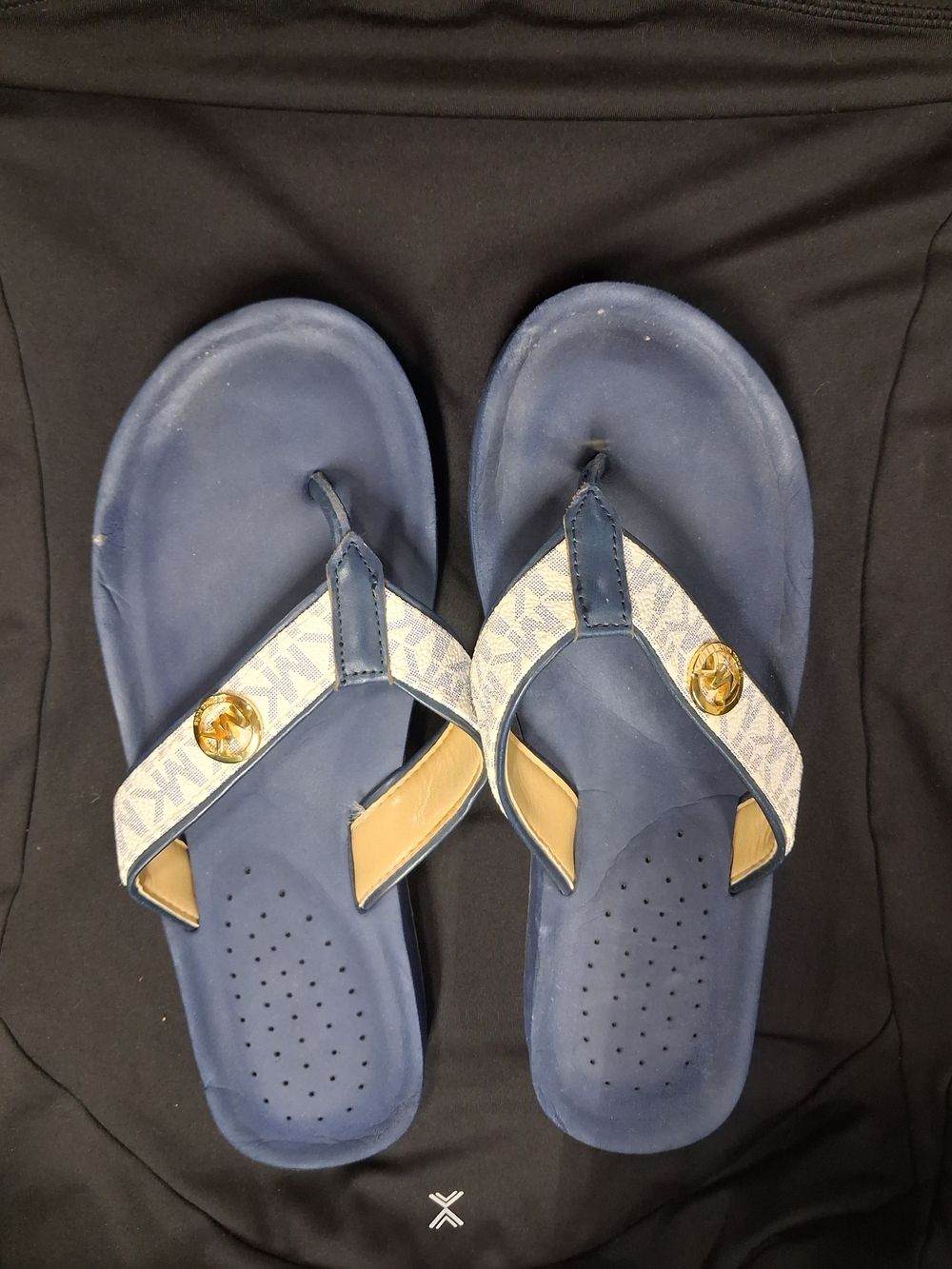 Michael Kors Navy and Cream Logo Flip Flops with Gold MK Medallion